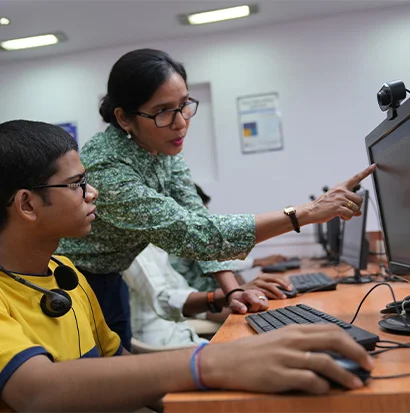 Personalized IT training from teachers at the Shrem Sewa Development Centre.