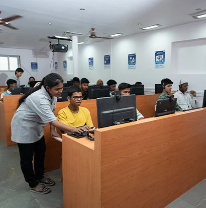 A teacher explaining concepts using modern technology at the Shrem Sewa Development Centre.